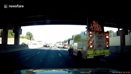 Brazen driver attempts to pass emergency vehicle attending to car crash victims in Atlanta