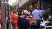 Firemen rescue girl hanging from seventh-floor window in eastern China
