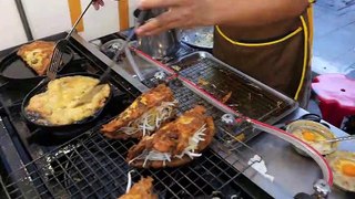 Roadside snacks in Bangkok, Thailand Street food - mussels and seafood omelet