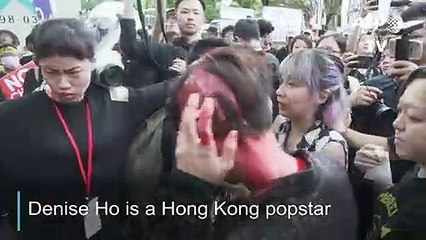 Hong Kong popstar Denise Ho doused with red paint by masked man at Taiwan rally