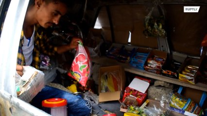 Yemeni family transforms war-destroyed car into shop