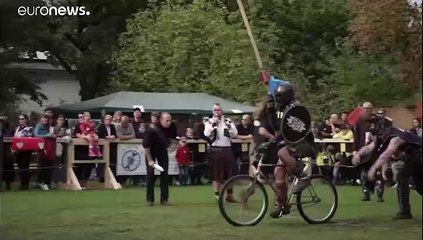 Knights participate in jousting contest on bikes in Berlin
