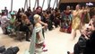 Nine-year-old amputee models on catwalk in Paris Fashion Week
