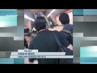 Actos vandálicos ensombrecen marcha por los 43 de Ayotzinapa