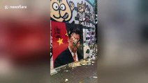 Hong Kong protesters THROW EGGS at portrait of Chinese President Xi Jinping