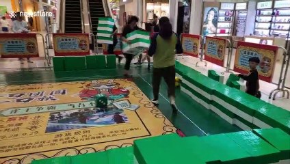 Shoppers play giant game of mahjong at Chinese mall