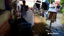 Life goes on despite floodwaters in India