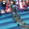 Guy Trying to Crawl on Ladder at a Fair Faces Double Fall