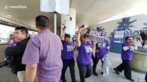 Rideshare drivers and union workers march at Los Angeles airport block traffic to demand better rights