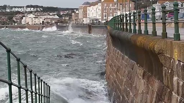 Waves crash against seawall in Cornwall as Hurricane Lorenzo reaches UK