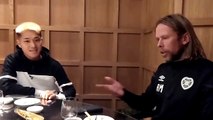 Hearts player Ryo Meshino and coach Austin MacPhee give a Japanese lesson