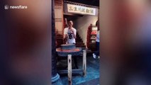 Hilarious scene as Chinese man performs spicy dance routine while grinding chillis