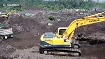 Guatemala excavating for more than 100 missing bodies from last year's volcanic eruption