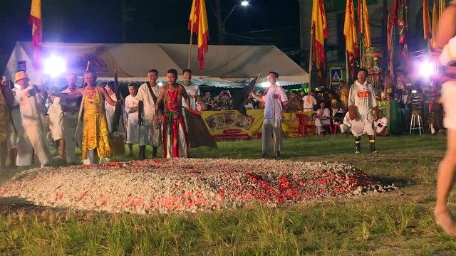 Devotees walk on burning coal during Phuket vegetarian festival
