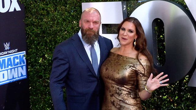 Triple H and Stephanie McMahon WWE 20th Anniversary Celebration Event Blue Carpet
