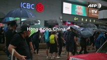 Police fire tear gas as large crowds defy Hong Kong mask ban