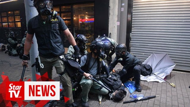 Arrests as mask ban fails to quell Hong Kong protests