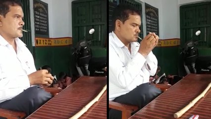 क्लासरूम में बच्चों के सामने बीड़ी पीते नजर आए मास्टर साहब, वीडियो वायरल होने पर गिरी गाज