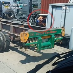 Three men robbing a truck driver along Road 10 Manila