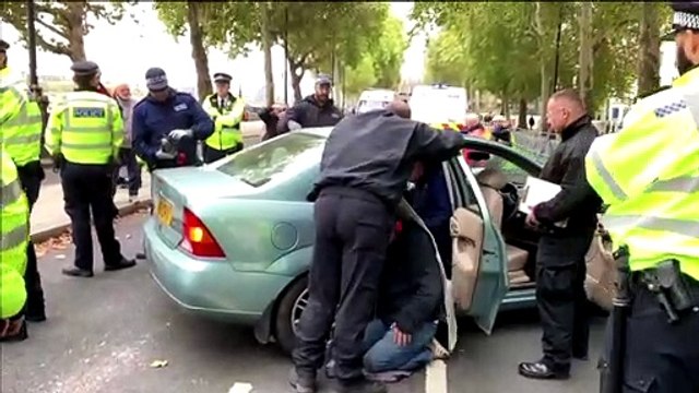 London police arrest 21 climate change protesters as mass action starts