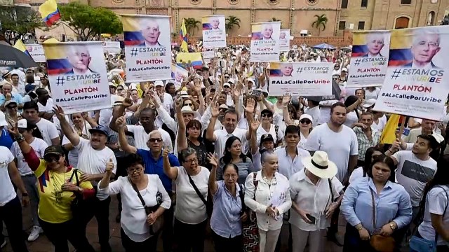 Hundreds march in defence of former Colombian President Uribe