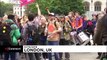 Extinction Rebellion activists glue hands to ground  in central London
