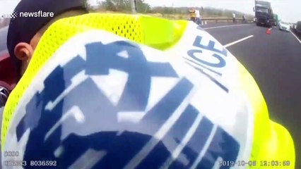 Hero highway cops in China shove BURNING car off road - to prevent traffic jam