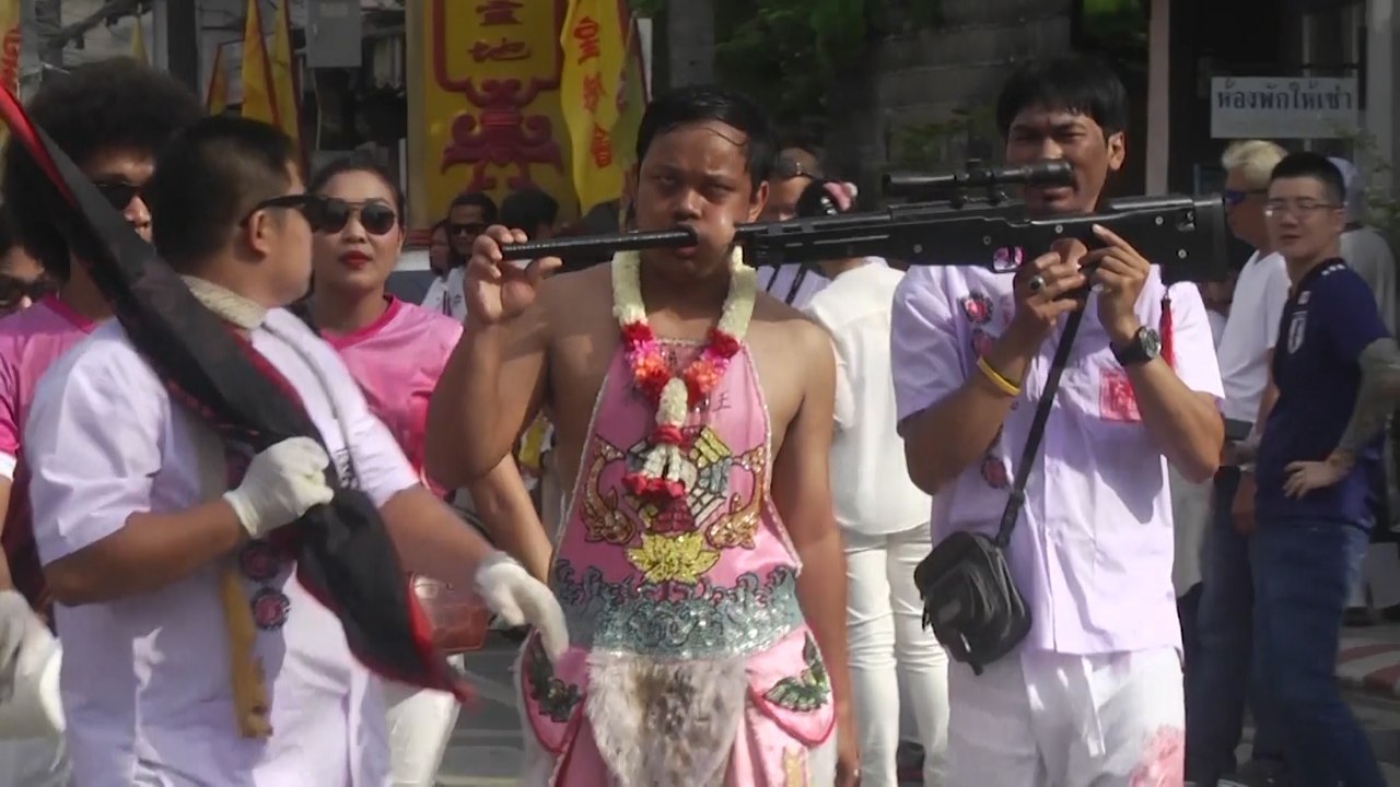 Devotees pierce faces during annual vegetarian festival in Phuket, Thailand