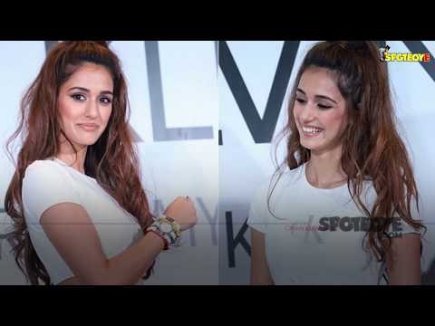 Disha Patani Flaunts Toned Midriff in Classic Blue Jeans and White Top at Calvin Klein Event