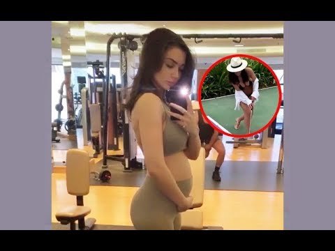 Amy Jackson Flaunts Her Baby Bump In Bikini While Playing Golf