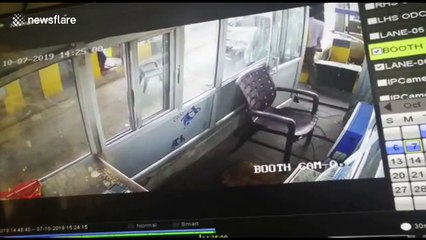 Woman in central India smashes up toll booth when asked to pay fee