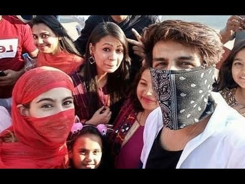 Kartik Aaryan And Sara Ali Khan Click Selfies With Fans But With Their Faces Covered | SpotboyE