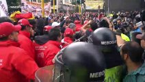 Supporters and opponents of Former Colombian president face off outside court in Bogota