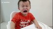 Toddler stops crying instantly when given money by his dad