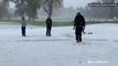 Probably hard to find the ball as golfers brave unfavorable golf elements