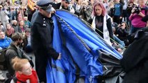 Extinction Rebellion protesters clash with police as tents get dismantled at London's Trafalgar Square