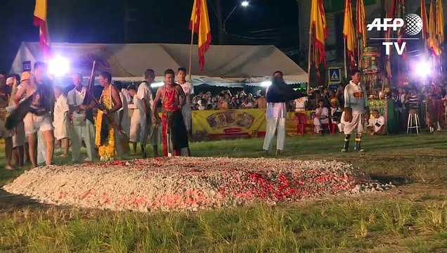 Devotees walk on burning coal during Phuket vegetarian festival