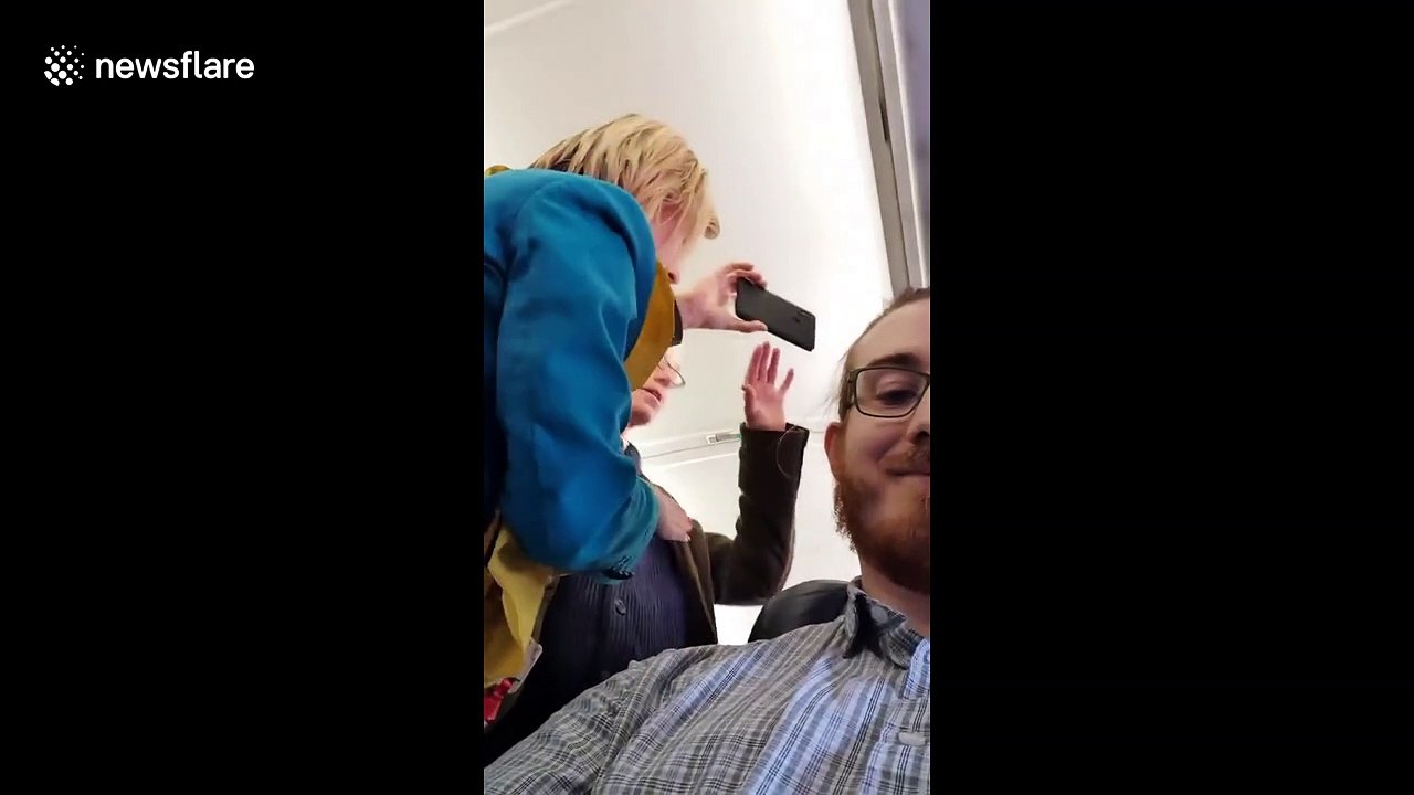 Moment Extinction Rebellion protester is arrested on board plane after stopping flight from London City Airport