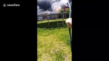 Intense scene as enormous inferno engulfs backyard in Australia while man tries to singlehandedly fight fire