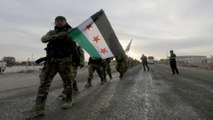 Turkey-backed Syrian fighters 'seize' key town in offensive