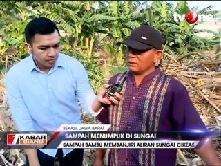 Aliran Sungai Cikeas Dibanjiri Sampah Bambu