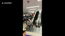 Dad-core parkour: dad tries to be cool with escalator but fails miserably