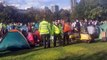 Police officers converge on Extinction Rebellion protesters in Vauxhall Park