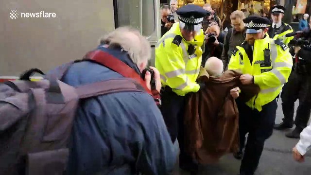Police arrest elderly Extinction rebellion protester in Whitehall