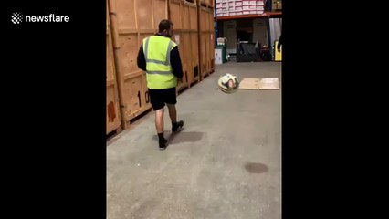 Man nonchalantly backheel volleys football into bin at work