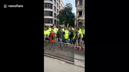 General strike begins as workers march through the centre of Barcelona
