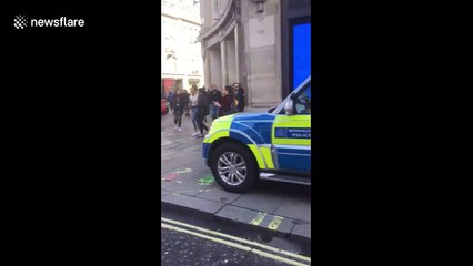 Extinction Rebellion protesters block off Oxford Circus using massive wooden structures