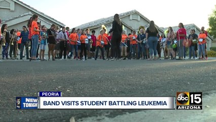 Valley high school band visits student battling leukemia