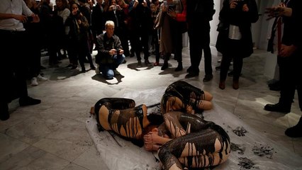 Oil on canvas: Semi-naked climate activists protest BP art sponsorship