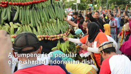 Towering support: giant food cone erected for Indonesia inauguration